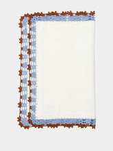 House of Capricorn Hand-Embroidered Leonor White Linen With Blue and Brown Crochet Placemat