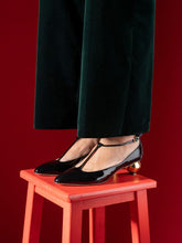 Ferragamo Black T-Strap Pumps with Gold Heel