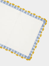 House of Capricorn Hand-Embroidered Leonor White Linen With Blue and Yellow Crochet Placemat