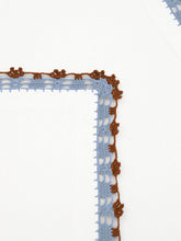 House of Capricorn Hand-Embroidered Leonor Ecru Linen with Blue and Brown Crochet Napkin